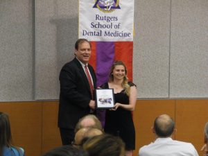 Rutgers School of Dental Medicine graduate Caroline Tuttle and Dr. Christopher Hughes