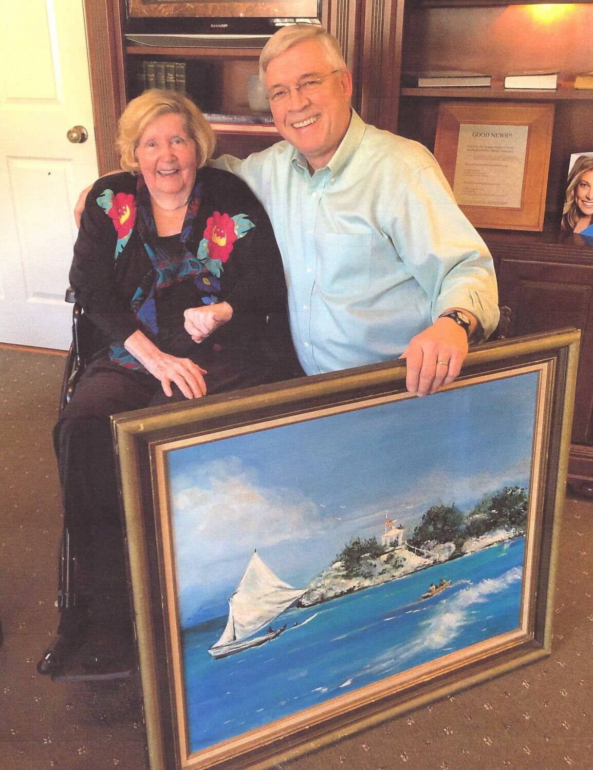 Myrtle and Dr. Ken Friday with patient’s artwork